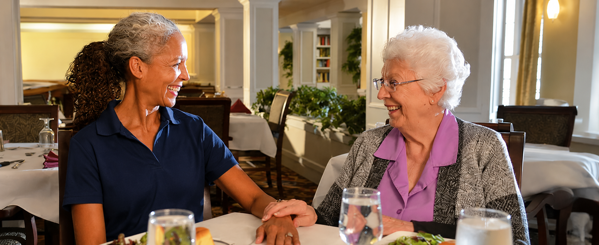 Caregiver and older adult enjoying a meal together